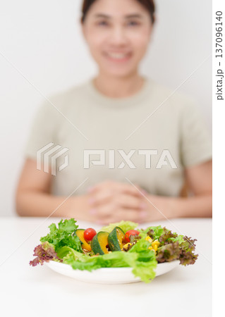 happy smiling woman with fresh organic vegetables plate. healthy nutrition, weight loss, clean eating, Healthy food eating, Vegan, Wellness, Green dieting and Healthy lifestyle happy smiling woman with fresh organic vegetables plate. healthy nutrition, weight loss, clean eating, Healthy food eating, Vegan, Wellness, Green dieting and Healthy lifestyle 137096140