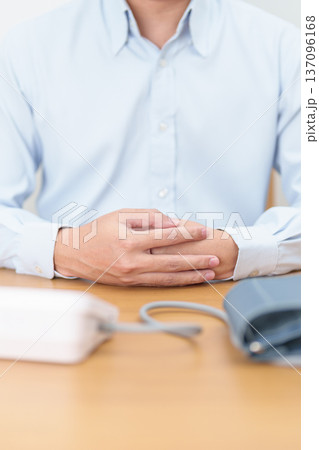 Man checking Blood pressure by Blood pressure monitor with Cuff. Systolic, SYS, Diastolic, DIA, Pulse, Hypertension, Hypotension, Heart rate, Cardiovascular Disease and May World hypertension day Man checking Blood pressure by Blood pressure monitor with Cuff. Systolic, SYS, Diastolic, DIA, Pulse, Hypertension, Hypotension, Heart rate, Cardiovascular Disease and May World hypertension day 137096168