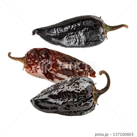 Dried chili peppers scattered and isolated on white background, spicy food concept, showcasing culinary ingredients texture Dried chili peppers scattered and isolated on white background, spicy food concept, showcasing culinary ingredients texture 137100803