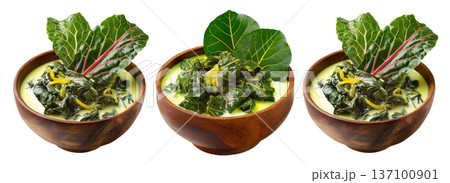 Rourou cooked taro leaves in creamy coconut milk, served in wooden bowl with garnishes, isolated on white background, Fiji cuisine 137100901