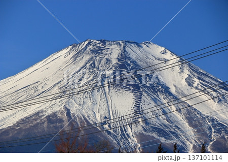 Closeup of Mt. Fuji, Fuji-san, Fujiyama, as seen from Lake Yamanakako in Yamanashi Japan during the winter. Closeup of Mt. Fuji, Fuji-san, Fujiyama, as seen from Lake Yamanakako in Yamanashi Japan during the winter. 137101114