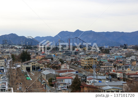 View of Fuji Q Highland park from the roof of the Fujisan, Mt. Fuji, train station of Yamanakako in Yamanashi Japan during an overcast winter day 137101720