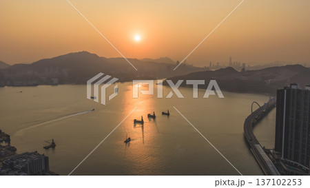 Warm Sunset Reflections Glow Across Tranquil Junk Bay Waters Feb 22 2026 137102253