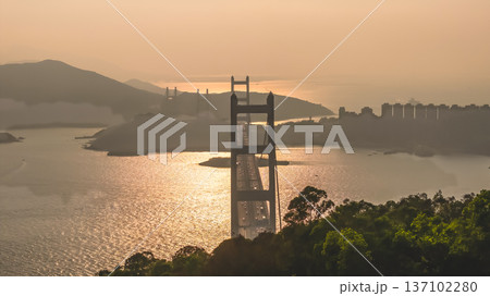 Iconic Suspension Bridge Illuminated At Sunset Over Tranquil Waters Feb 21 2026 Iconic Suspension Bridge Illuminated At Sunset Over Tranquil Waters Feb 21 2026 137102280