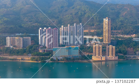 Scenic Hillside Coastline Blending Industry, Housing, And Natural Landscape Feb 21 2026 137102287