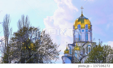 Easter.Majestic Christian church with golden domes and spring sky 137106272