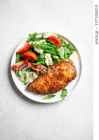 Breaded Chicken with salad 137106818