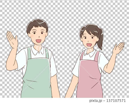 笑顔で案内をする爽やかなエプロン姿の男女 137107571