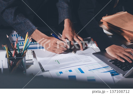 Professional photo of a person's hands reviewing a contract or legal document on a desk, for concepts of business, finance, and legal affairs Professional photo of a person's hands reviewing a contract or legal document on a desk, for concepts of business, finance, and legal affairs 137108712