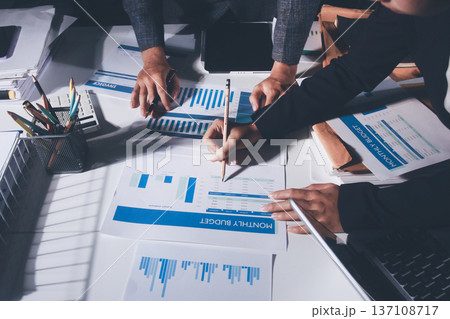 Professional photo of a person's hands reviewing a contract or legal document on a desk, for concepts of business, finance, and legal affairs Professional photo of a person's hands reviewing a contract or legal document on a desk, for concepts of business, finance, and legal affairs 137108717