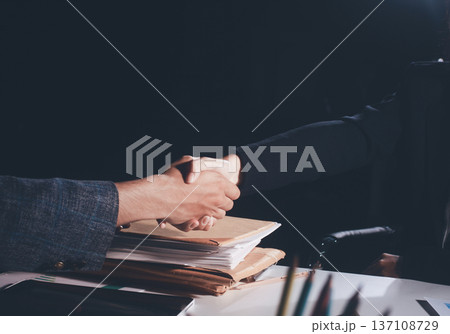 Professional photo of a person's hands reviewing a contract or legal document on a desk, for concepts of business, finance, and legal affairs Professional photo of a person's hands reviewing a contract or legal document on a desk, for concepts of business, finance, and legal affairs 137108729