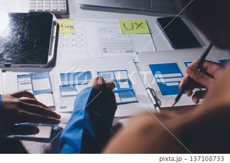 UXUI design brainstorming session with sketches and digital tools 137108733