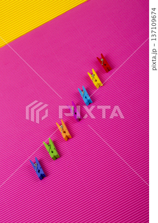 A background of many colorful wooden clothespins. A background of many colorful wooden clothespins. 137109674