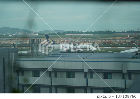 Singapore Airlines Plane on Tarmac at Major Airport Hub Singapore Airlines Plane on Tarmac at Major Airport Hub 137109760