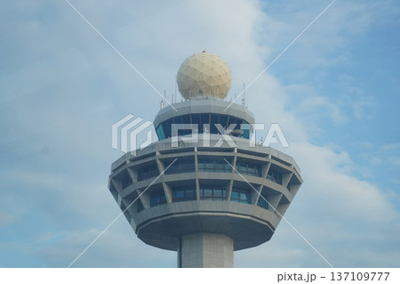 Modern Air Traffic Control Tower with Radome against Blue Sky Modern Air Traffic Control Tower with Radome against Blue Sky 137109777