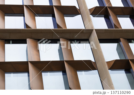 Abstract view of modern office building facade with wooden fins 137110290