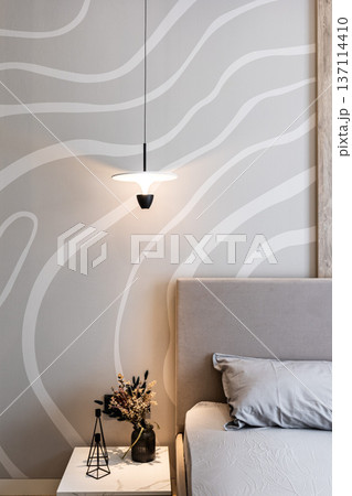 Modern bedroom with pendant lamp and wavy wall Modern bedroom with pendant lamp and wavy wall 137114410