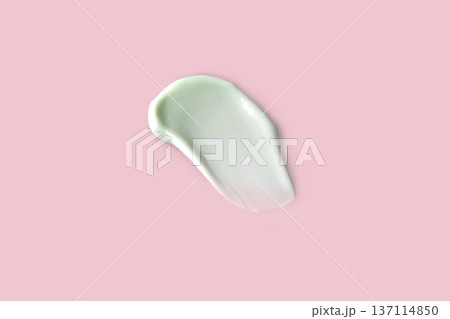 Swatch, smear of white cream. Face, hand, body skin care, facial care. Isolated photo pink background 137114850