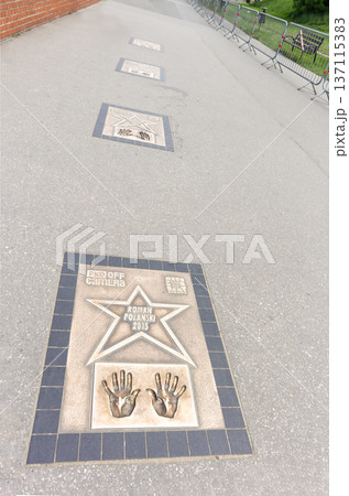 KRAKOW, POLAND - MAY 13, 2023. Walk along the Walk of Fame, the Walk of Stars near the Royal Wawel KRAKOW, POLAND - MAY 13, 2023. Walk along the Walk of Fame, the Walk of Stars near the Royal Wawel 137115383