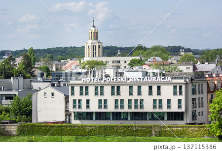 Krakow, Poland, May 13, 2023. View of the Poleski Hotel from the Vistula River. Krakow, Poland, May 13, 2023. View of the Poleski Hotel from the Vistula River. 137115386