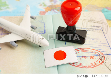 Japan passport with approved stamp on document for tourism to immigration at airport in country. 137116046