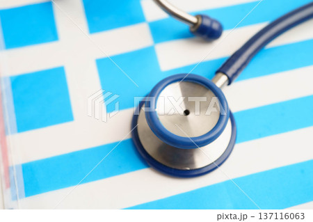 Greece flag with black stethoscope, Business and finance concept. Greece flag with black stethoscope, Business and finance concept. 137116063