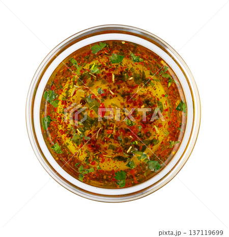 Chimichurri sauce in bowl with herbs and spices 137119699
