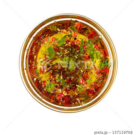 Chimichurri sauce in clear glass bowl overhead Chimichurri sauce in clear glass bowl overhead 137119708