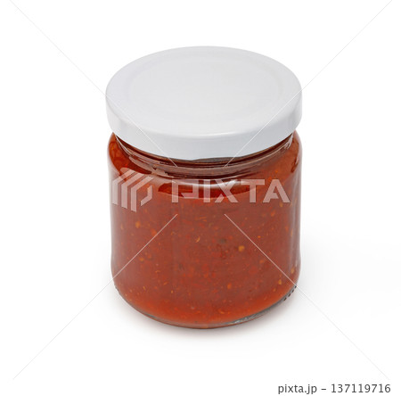 Glass jar filled with red preserving homemade food Glass jar filled with red preserving homemade food 137119716