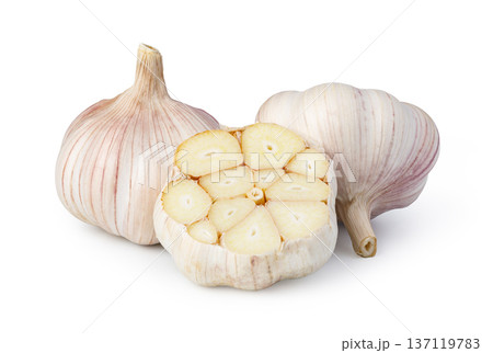 Garlic bulbs and sliced clove on white background Garlic bulbs and sliced clove on white background 137119783
