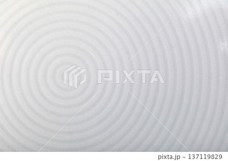 White ceramic plate displaying subtle ripple patterns 137119829