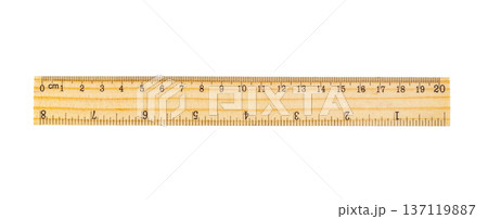 Wooden ruler showing metric and imperial measurement scales 137119887