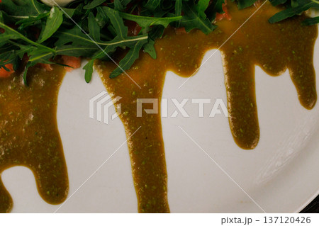 A plate with sliced red fish, bread and greens A plate with sliced red fish, bread and greens 137120426