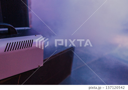 Smoke comes out of a smoke machine at a restaurant Smoke comes out of a smoke machine at a restaurant 137120542