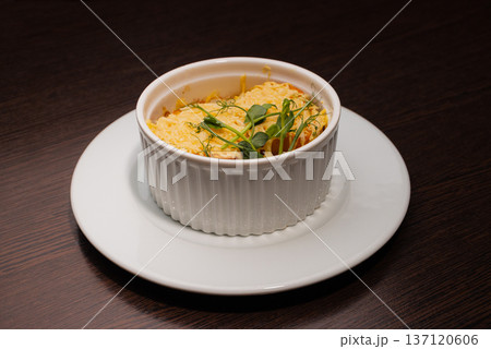 Onion soup in a white bowl looks delicious, with Onion soup in a white bowl looks delicious, with 137120606