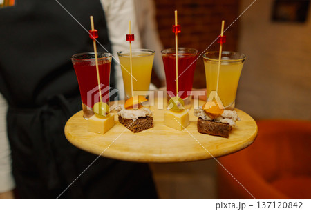 Liqueurs of different colors in shot glasses Liqueurs of different colors in shot glasses 137120842