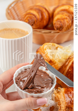 Chocolate Spread Close Up with Croissant and Coffee Chocolate Spread Close Up with Croissant and Coffee 137121109