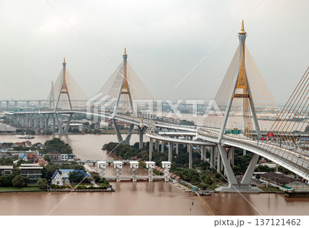 Spanning the Chao Phraya River in two distinct sections, the Bhumibol Bridge is an impressive cable-stayed structure. Known as the Industrial Ring Road Bridge. Spanning the Chao Phraya River in two distinct sections, the Bhumibol Bridge is an impressive cable-stayed structure. Known as the Industrial Ring Road Bridge. 137121462