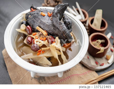 Widely celebrated in Chinese and Asian culinary traditions, the nourishing health stew pictured is known as "Black Chicken Soup" or "silkie chicken soup". Widely celebrated in Chinese and Asian culinary traditions, the nourishing health stew pictured is known as "Black Chicken Soup" or "silkie chicken soup". 137121465
