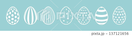 Set of white silhouettes of Easter eggs on a blue background. 137121656