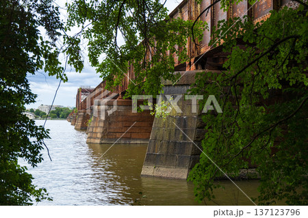 A bridge over a river with a bridge in the background 137123796