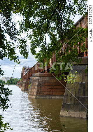 A bridge with a bridge over a river 137123797