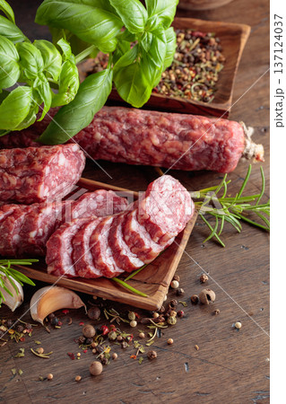 Sliced smoked sausage with herbs and spices. Sliced smoked sausage with herbs and spices. 137124037