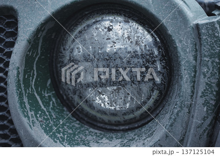 Dirty Off Road Vehicle Headlight Close Up After Mud Drive Dirty Off Road Vehicle Headlight Close Up After Mud Drive 137125104