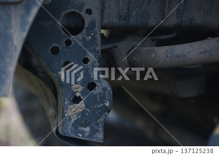Close Up of Worn Car Suspension Frame Detailed view of aged vehicle chassis metal parts with dirt corrosion and mechanical structure texture Close Up of Worn Car Suspension Frame Detailed view of aged vehicle chassis metal parts with dirt corrosion and mechanical structure texture 137125238