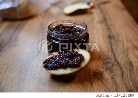 Delicious toasted bread with strawberry jam oozing out, served on a white plate. Perfect for a sweet breakfast or snack. Delicious toasted bread with strawberry jam oozing out, served on a white plate. Perfect for a sweet breakfast or snack. 137125894