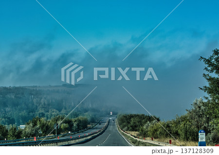Foggy Lake Landscape with Distant Shoreline and Calm Water Foggy Lake Landscape with Distant Shoreline and Calm Water 137128309