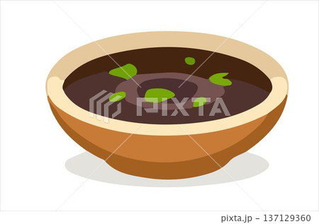 A vibrant bowl of black bean soup garnished with herbs. 137129360