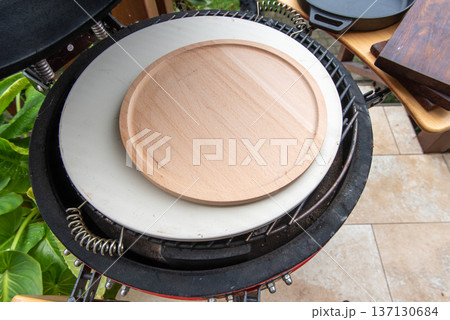 Ceramic grill with ceramic pan and wooden plate Ceramic grill with ceramic pan and wooden plate 137130684