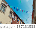 Festive bunting and lanterns decorate a narrow street for summer festival in June San Juan 137131533